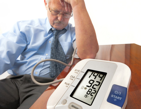 man on blood pressure monitor